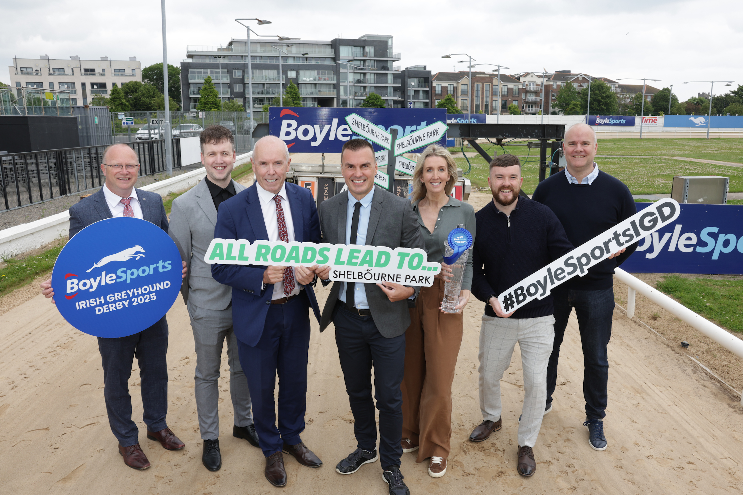Picture shows a group of people standing on the track at Shelbourne Park Greyhound Stadium for the 2025 BoyleSports Irish Greyhound Derby