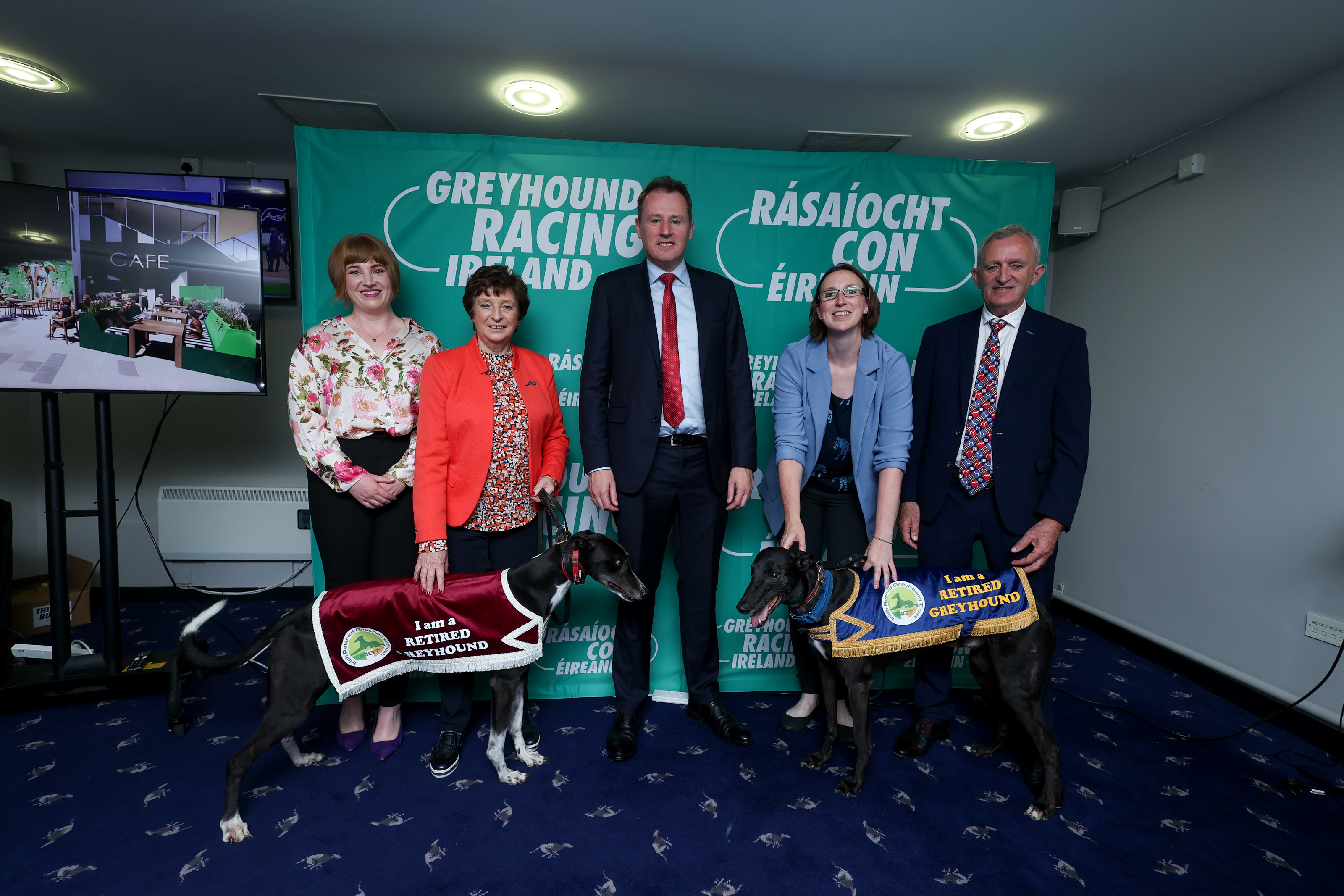 IRGT Trustees with retired greyhounds Socks and Sergio pictured with Minister Charlie McConalogue in Shelbourne Park at the 2023 BoyleSports Irish Greyhound Derby