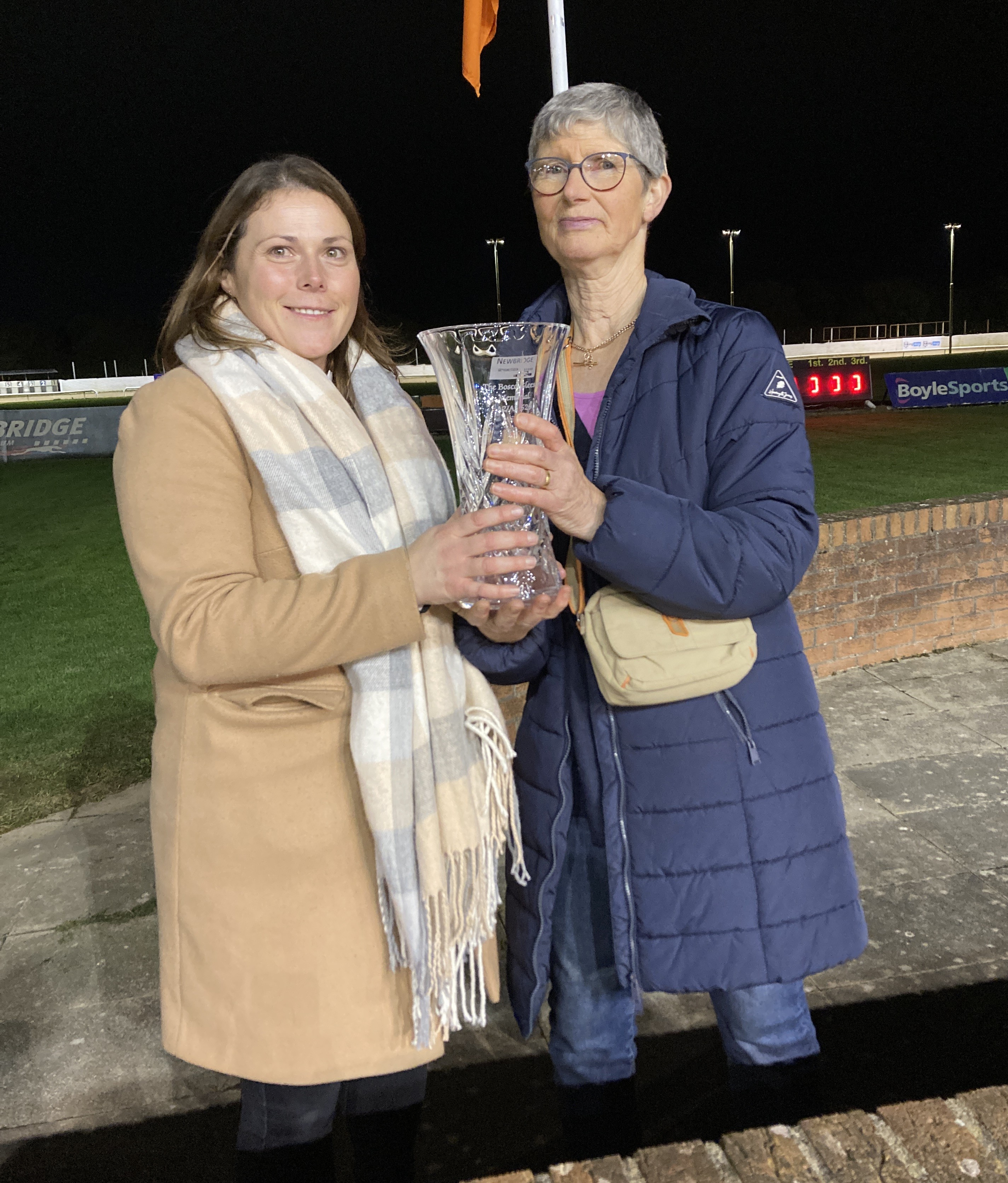 Racing manager Joyce Black and sponsor Anna Gleeson admire the trophy for the Bosco Gleeson Memorial stake at Newbridge.