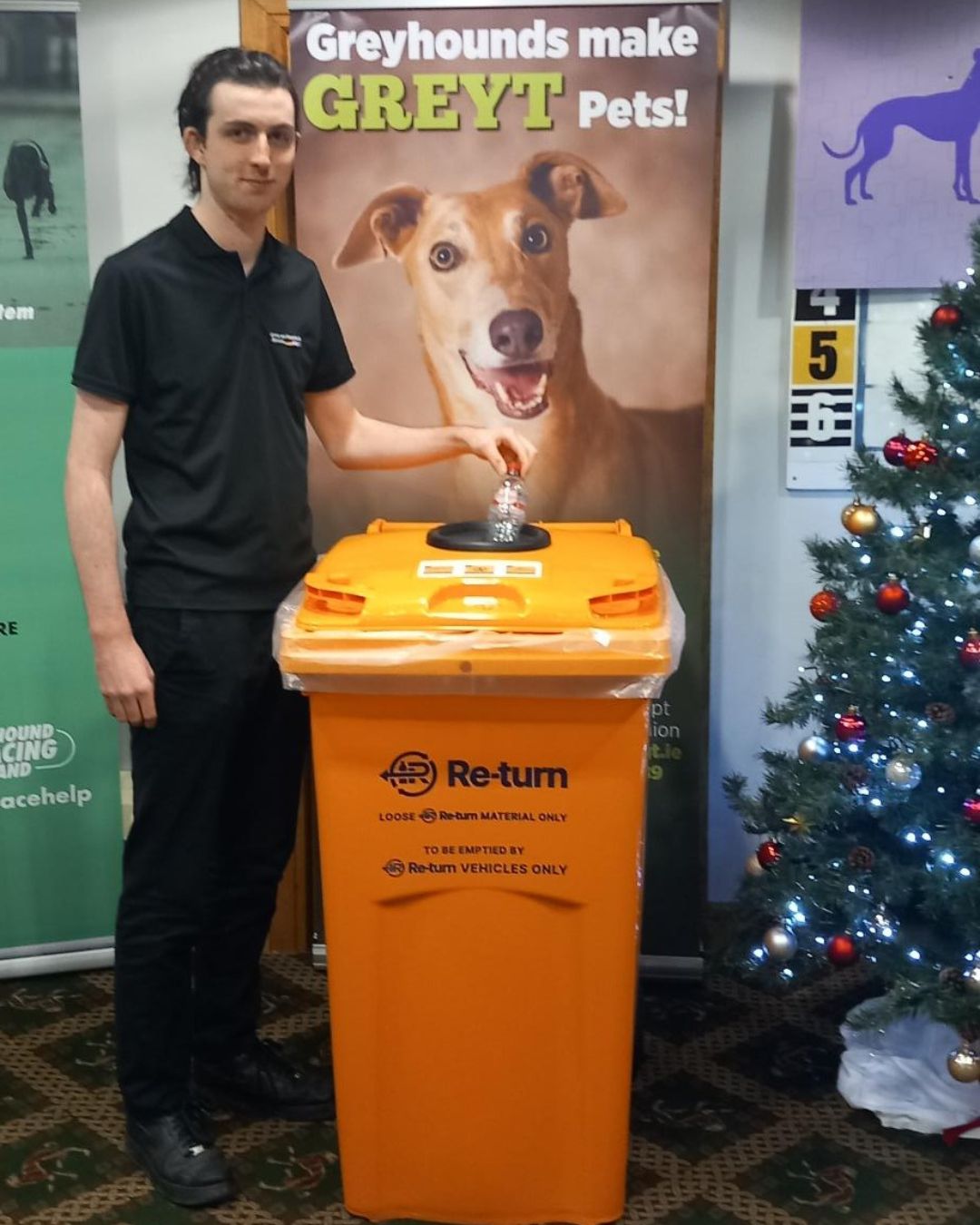 A Male Member Of Staff At Galway Greyhound Stadium Using The New Return Deposit Bins