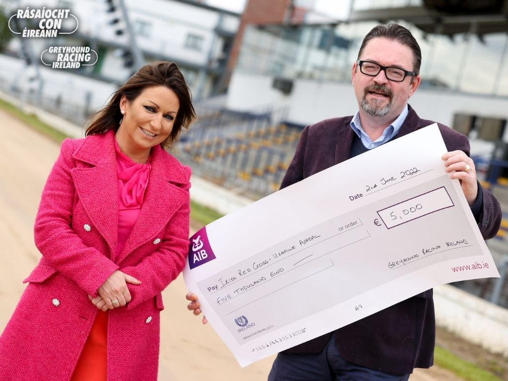Dearbhla O'Brien, CEO of Greyhound Racing Ireland presents €5,000 to Frank Phelan of the Irish Red Cross.   This was raised from greyhound stadia activities nationwide over a 7-day period in aid of the Irish Red Cross Ukraine Appeal 